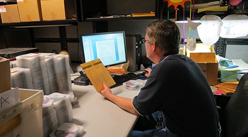 Man at Computer with Digital Evidence