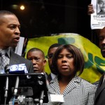 Rev. Keith Muhammad (left), is joined by Oscar Grant's mother, Wanda Johnson, and uncle, Cephus Johnson, during a midday press conference in Los Angeles.