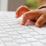 child_using_computer_keyboard