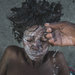 A cholera patient at a clinic in Rendel, Haiti, being bathed with soap and water mixed with Clorox.