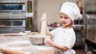 Girl baking with flour 