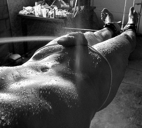 A naked man is bound and hosed with a jet of water directed at his genitals.
This photograph, suggested by Bailadora, reminds me of one of the ways I used to masturbate as an adolescent. Although I didnt have the bondage gear, I did have a very...