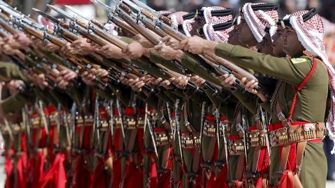 Jordanian honor guards perform during a ceremony to honor war veterans and retired servicemen during Veterans Day, as part of celebrations for the 100th anniversary of the Great Arab Revolt, at the Royal Palace in Amman, Jordan, February 15, 2016. 