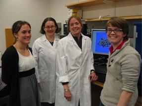 Photo of Maureen Devlin, Ph.D. (second from left) and Mary Bouxsein, Ph.D. (second from right) along with two research assistants.