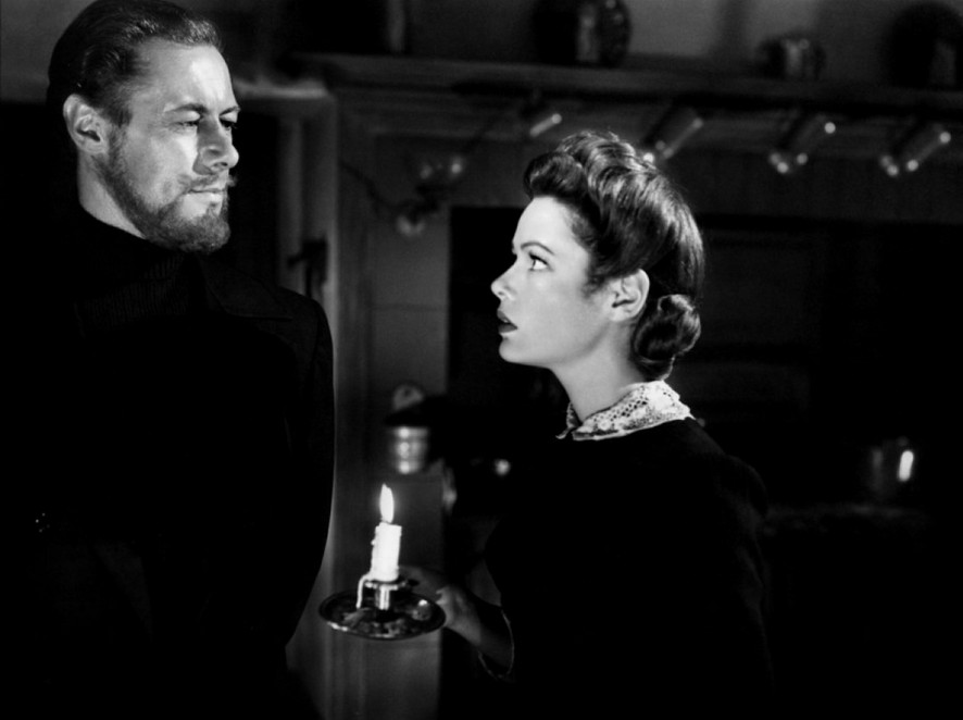 Ghost meets girl: Their first scene together and the only it-was-a-dark-and-stormy-night scene. The dark kitchen and both of them in black establishes that their romance will be disembodied, a relationship of spirits.