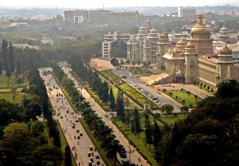Traffic moves along a road in the southern Indian city of Bangalore December 14, 2005. Bangalore, long known as India's Garden City and now a global technology hub, is set to change its name to Bengalooru, reverting to a centuries-old title that means "the town of boiled beans".