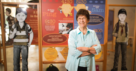 Nancy pine standing in front of her poster