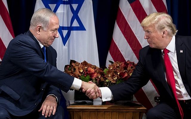 Prime Minister Benjamin Netanyahu (L) and US President Donald Trump shake hands prior to their meeting at the Palace Hotel in New York City ahead of the United Nations General Assembly on September 18, 2017.(AFP Photo/Brendan Smialowski)