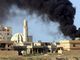 epa04687694 Smoke rises during fighting between Iraqi