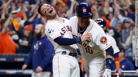 HOUSTON, TX - OCTOBER 29: Jose Altuve #27 and Yuli Gurriel #10 of the Houston Astros celebrate after a two-run home run by Carlos Correa #1 (not pictured) during the seventh inning against the Los Angeles Dodgers in game five of the 2017 World Series at Minute Maid Park on October 29, 2017 in Houston, Texas.  (Photo by Jamie Squire/Getty Images)