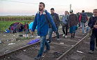 Mohammed al-Haj, front left, and his friends walk on the railway tracks near the Serbian village of Horgos. 