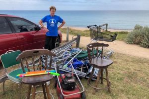 A lawnmower, chairs and broken marquees were among the litter on Safety Beach.
