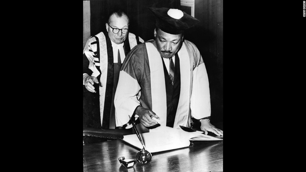King signs the Degree Roll at Newcastle University after receiving an honorary Doctor of Civil Law degree, in Newcastle, England, on November 14, 1967.