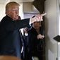 President Donald Trump talks with reporters aboard Air Force One, Thursday, April 5, 2018. (AP Photo/Evan Vucci)