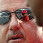Washington Nationals general manager Mike Rizzo speaks with manager Dave Martinez, seen in Rizzo&#39;s sunglasses, before the home opener baseball game against the New York Mets at Nationals Park, Thursday, April 5, 2018, in Washington. (AP Photo/Alex Brandon)