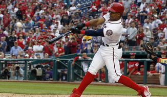 Washington Nationals&#39; Wilmer Difo hits a walkoff RBI-single during the ninth inning of a baseball game against the Philadelphia Phillies at Nationals Park, Sunday, May 6, 2018, in Washington. (AP Photo/Alex Brandon)