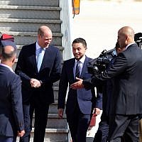 Prince William (L) is greeted at Amman's Marka military airport by Jordanian Crown Prince Hussein bin Abdullah on June 24, 2018. 
Prince William arrived in Jordan at the start of a Middle East tour that will see him become the first British royal to pay official visits to both Israel and the Palestinian territories. (AFP PHOTO / KHALIL MAZRAAWI)