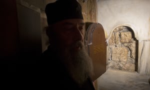 A window cut into the burial chamber of Jesus’s tomb for pilgrims to see what is believed to be the original stone wall of the burial cave.