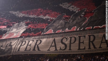 AC Milan supporters deploy a giant banner before the Italian Serie A football match Inter Milan Vs AC Milan on October 15, 2017 at the &#39;San Siro Stadium&#39; in Milan.  / AFP PHOTO / MARCO BERTORELLO        (Photo credit should read MARCO BERTORELLO/AFP/Getty Images)