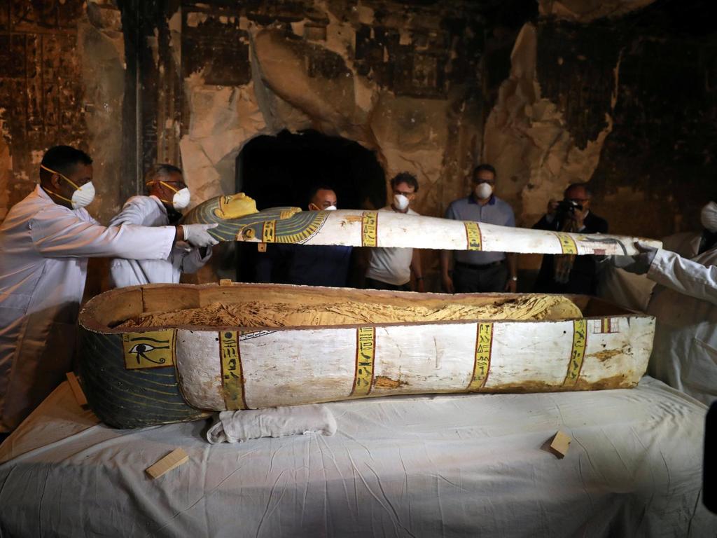 Archaeologists remove the cover of an intact sarcophagus inside the tomb TT33 in Luxor, Egypt November 24, 2018. Reuters