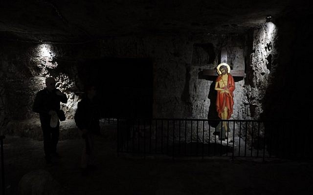 A Christian worshiper visits the "Prison of Christ" in the church of Holy Monastery of the Praetorium, traditionally believed to be the site where Jesus was detained, in Jerusalem's Old City on February 8, 2019. (Thomas Coex/AFP)