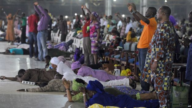 Worshippers pray into the New Year lying down during the crossover watch night church service at the Redemption Camp on Lagos Ibadan highway on 1 January , 2014.