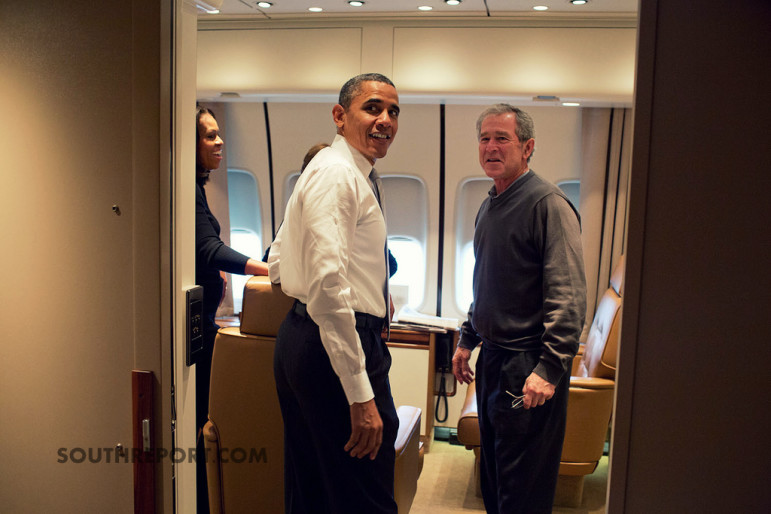 President Obama and former president George Bush aboard Airforce One enroute South Africa.