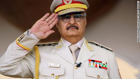 Libya&#39;s Khalifa Haftar salutes during a military parade in the eastern city of Benghazi on May 7, 2018.