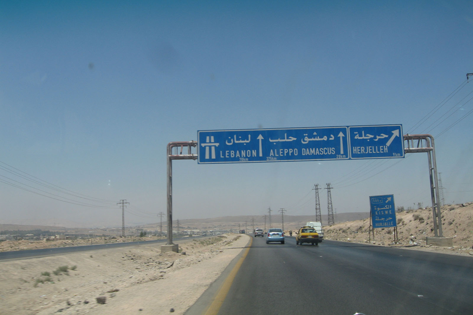Directional highway sign to Lebanon, Aleppo, Damascus and Herjelleh