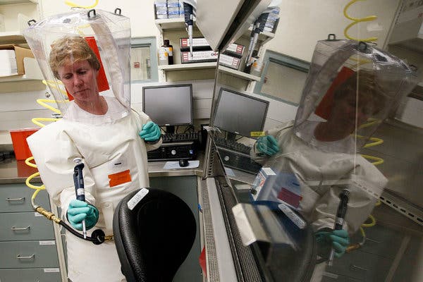 Denise Braun prepared to demonstrate lab work during a media tour at the  Army Medical Research Institute of Infectious Diseases in Fort Detrick, Md., in 2011.