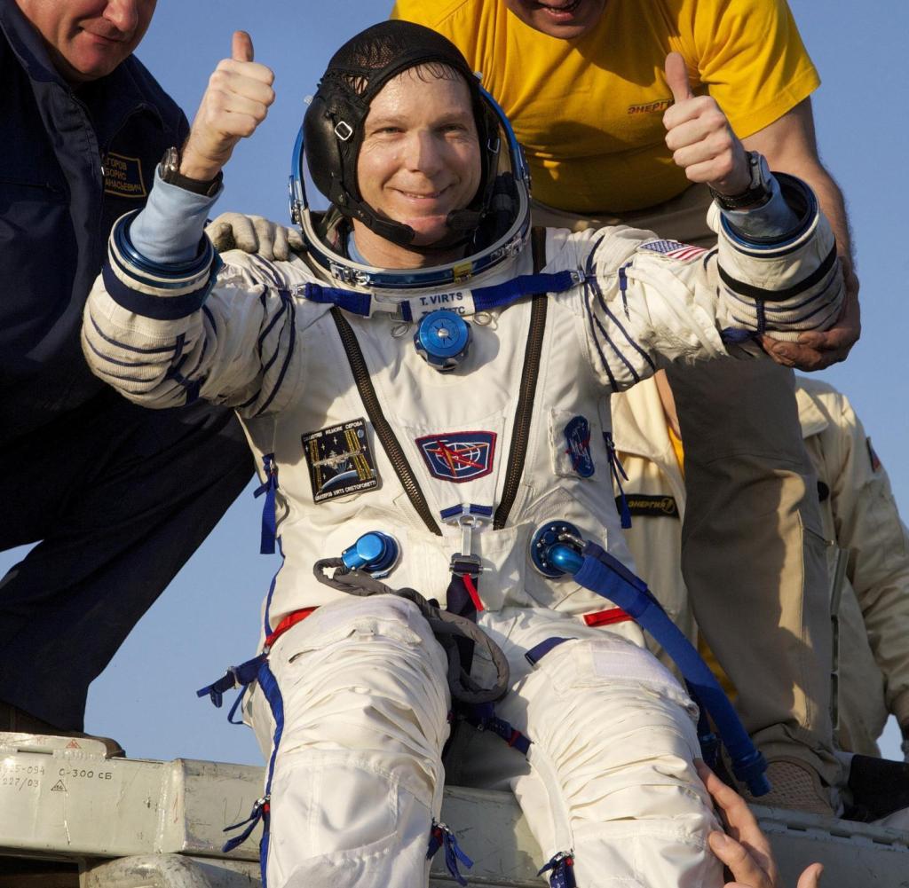 US astronaut Terry Virts gives his thumbs up as he is helped out of the Soyuz TMA-15M space capsule after he and Italian astronaut Samantha Cristoforetti and Russian cosmonaut Anton Shkaplerov landed in a remote area outside the town of Dzhezkazgan, Kazakhstan, on June 11, 2015. Three astronauts landed in Kazakhstan on June 11, safely returning to Earth after their flight back home was delayed for a month by a Russian rocket failure. AFP PHOTO / POOL / IVAN SEKRETAREV (Photo credit should read IVAN SEKRETAREV/AFP/Getty Images)