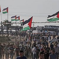 Palestinians demonstrate near the fence along the border with Israel in the eastern Gaza Strip on August 16, 2019. (Mahmud Hams/AFP)