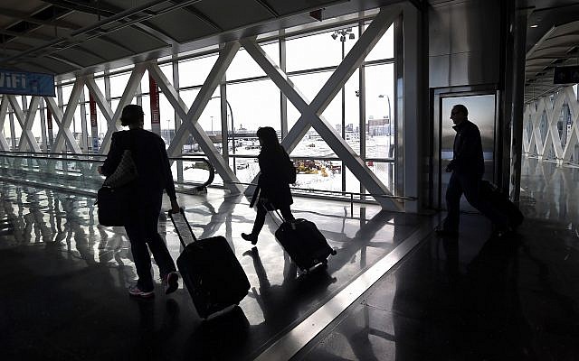 Illustrative: Travelers move through Logan International Airport in Boston January 28, 2015. (Elise Amendola/AP)