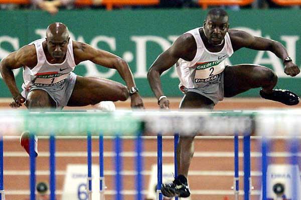 Ladji Doucoure (FRA) beats Allen Johnson (USA) in a French 60mH record in Lievin (AFP/Getty Images)
