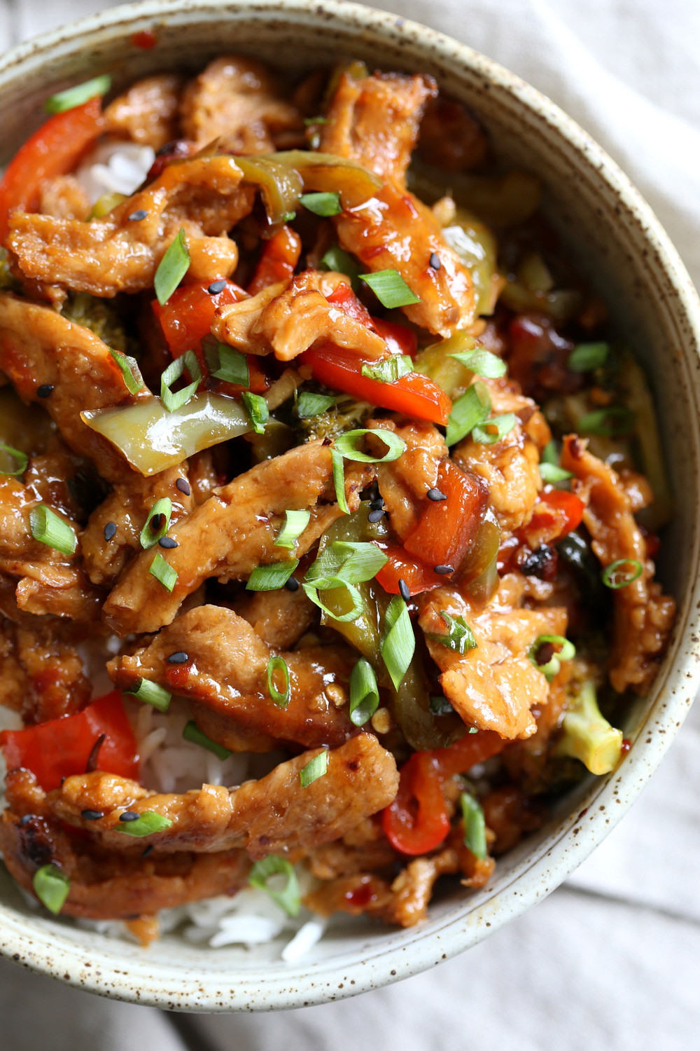 Vegan General Tso Soy curls in a speckled bowl