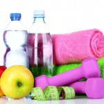 towel, dumbbells, apples and water bottle isolated on white