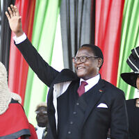 Malawi's newly elected President Lazarus Chakwera greets supporters after being sworn in in Lilongwe, Malawi, June 28, 2020. Chakwera is Malawi’s sixth president after winning the historic election held last week, the first time a court-overturned vote in Africa has resulted in the defeat of an incumbent leader. (AP Photo/Thoko Chikondi)