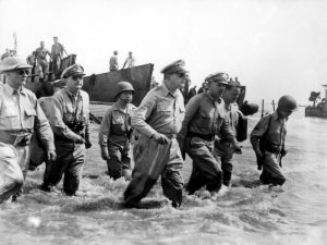 General MacArthur walks ashore at Palo, Leyte.