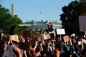 Washington Demonstrators hold up placards in a protest outside the White House on Monday