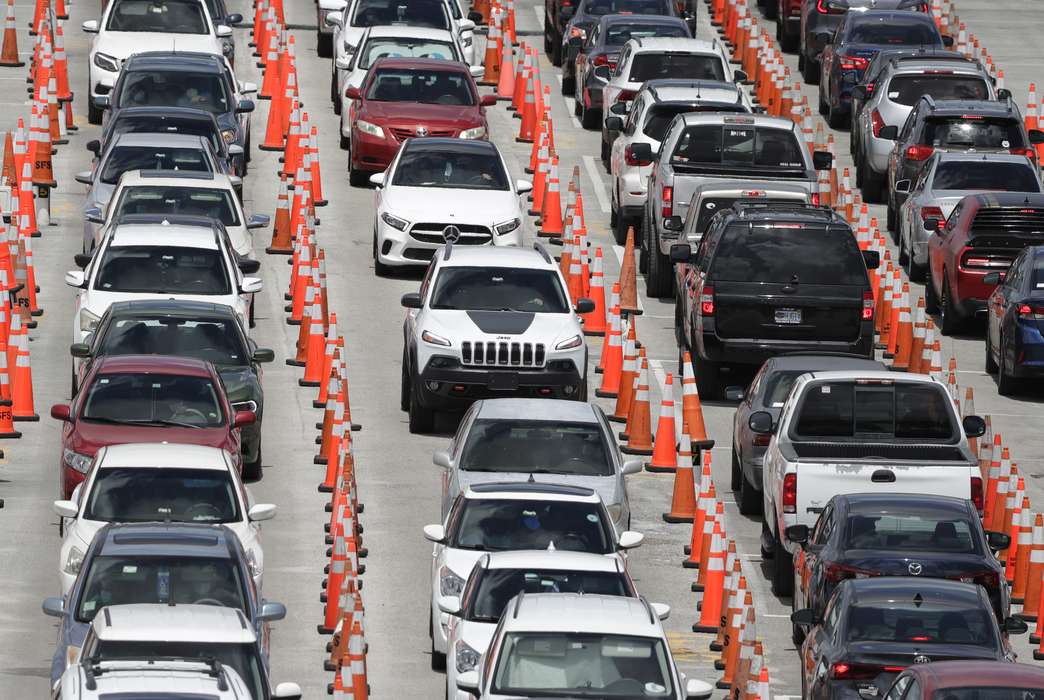 Lines of cars wait at a coronavirus testing site. (AP Photo/Wilfredo Lee)