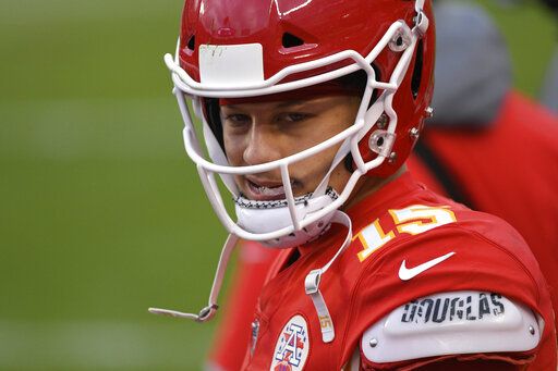 Kansas City Chiefs quarterback Patrick Mahomes walks on the sideline during the second half of an NFL divisional round football game against the Cleveland Browns, Sunday, Jan. 17, 2021, in Kansas City.