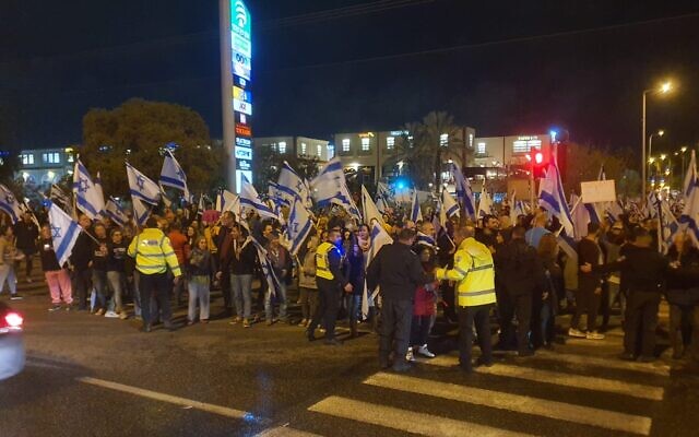 Israelis protest against plans by Prime Minister Benjamin Netanyahu's government to overhaul the Israel's judicial system, at the Karkur Junction, March 18, 2023. (Israel Police)