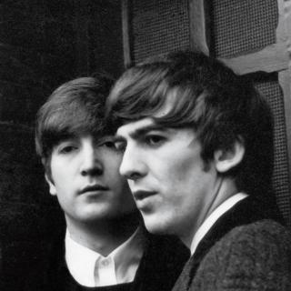 John Lennon and George Harrison in an image from Sir Paul McCartney’s personal collection of photographs, taken in 1964