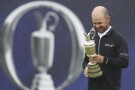United States' Brian Harman poses for the media as he holds the Claret Jug trophy for winning the British Open Golf Championships at the Royal Liverpool Golf Club in Hoylake, England, Sunday, July 23, 2023. (AP Photo/Peter Morrison)