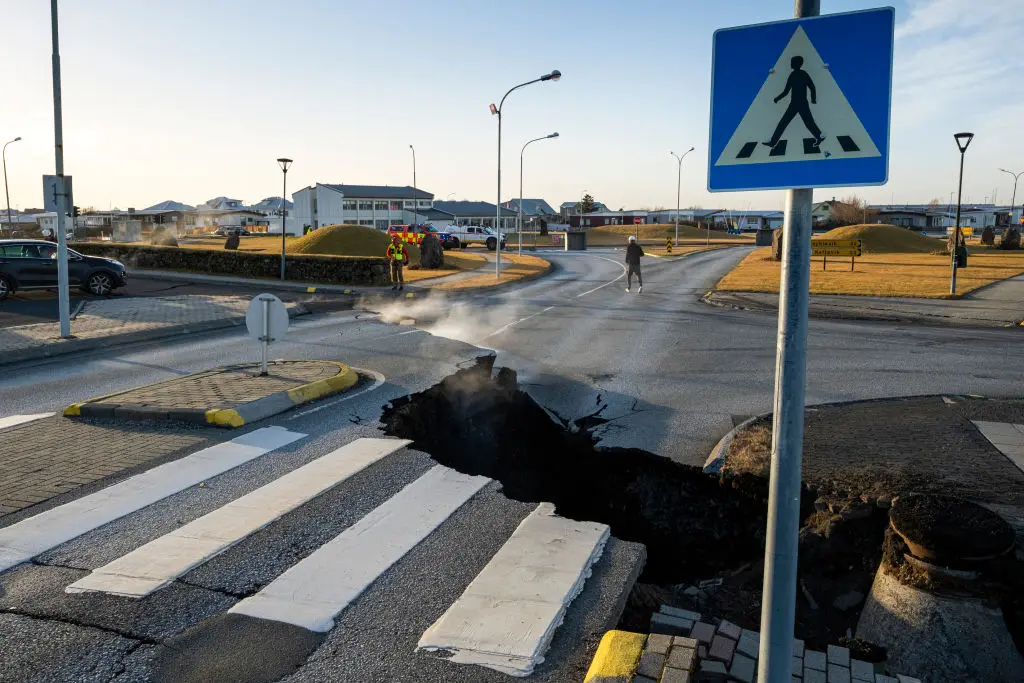 This photo taken on November 13, 2023 shows a crack cutting across the main road in Grindavik, southwestern Iceland following earthquakes.