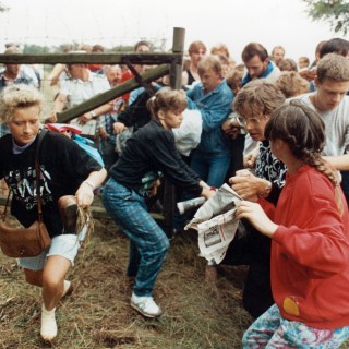 Bloc party: East Germans flee through a border gate near Sopron on August 19, 1989