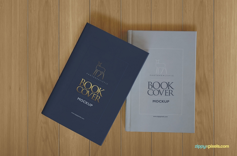 Hardcover book mockup showing two books with hardback and dustcover lying on table